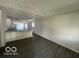Bright living room featuring hardwood floors and a view into the kitchen at 2914 Baltimore Ave, Indianapolis, IN 46218
