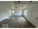Spacious living room with plenty of natural light and modern vinyl floors at 2914 Baltimore Ave, Indianapolis, IN 46218