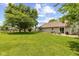 Spacious backyard with a patio, outdoor seating, and lush green grass perfect for outdoor activities at 31 Morningside Ct, Whiteland, IN 46184