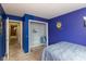 Comfortable bedroom with colorful walls and closet storage at 31 Morningside Ct, Whiteland, IN 46184
