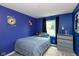 Bedroom features blue walls, decorative star accents and a double hung window at 31 Morningside Ct, Whiteland, IN 46184