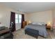 Bright bedroom features a neutral color palette, a double hung window and a computer desk at 31 Morningside Ct, Whiteland, IN 46184