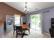 Bright dining area with sliding door access to the backyard and comfortable seating at 31 Morningside Ct, Whiteland, IN 46184