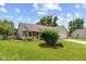 Charming single-story home with well-maintained lawn, landscaped garden beds, covered porch, and attached garage at 31 Morningside Ct, Whiteland, IN 46184