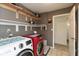 Laundry room with open shelving and modern washer and dryer set at 31 Morningside Ct, Whiteland, IN 46184