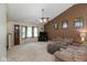 Comfortable living space with vaulted ceilings, neutral carpet, and a cozy atmosphere at 31 Morningside Ct, Whiteland, IN 46184
