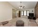 Spacious living room features neutral carpet, ceiling fan, and plenty of natural light at 31 Morningside Ct, Whiteland, IN 46184
