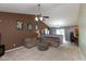 Inviting living room, flooded with light, seamlessly connects living, dining, and kitchen areas at 31 Morningside Ct, Whiteland, IN 46184