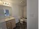 Bathroom featuring a vanity, mirror, toilet and bathtub at 3142 Lennon Ln, Indianapolis, IN 46235