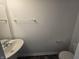 Half bathroom with pedestal sink and toilet at 3142 Lennon Ln, Indianapolis, IN 46235