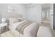 Peaceful bedroom featuring a comfortable bed, neutral decor, and an ensuite bathroom at 3142 Lennon Ln, Indianapolis, IN 46235