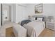 Cozy bedroom featuring a comfortable bed, neutral decor, and a walk-in closet at 3142 Lennon Ln, Indianapolis, IN 46235
