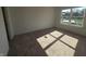 Bright bedroom with carpeted floors, large window overlooking the backyard at 3142 Lennon Ln, Indianapolis, IN 46235