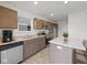 Well-equipped kitchen boasting stainless steel appliances, light countertops, and ample cabinetry at 3142 Lennon Ln, Indianapolis, IN 46235