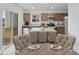 Modern kitchen with stainless steel appliances, a center island with seating, and a sliding door to the backyard at 3142 Lennon Ln, Indianapolis, IN 46235