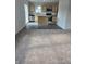 Open-concept kitchen with stainless steel appliances and a functional island, perfect for modern cooking and entertaining at 3142 Lennon Ln, Indianapolis, IN 46235