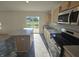 Bright, well-equipped kitchen with stainless steel appliances and a convenient island, ready for culinary adventures at 3142 Lennon Ln, Indianapolis, IN 46235