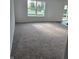 Inviting living room featuring neutral carpeting, offering a comfortable and versatile space to relax and enjoy at 3142 Lennon Ln, Indianapolis, IN 46235