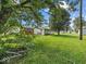 View of the expansive backyard and various outbuildings at 320 Sunset Dr, Shelbyville, IN 46176