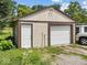Detached one car garage with white door and siding at 320 Sunset Dr, Shelbyville, IN 46176