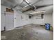 Unfinished interior of garage with shelving and a single window at 320 Sunset Dr, Shelbyville, IN 46176