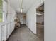 Spacious garage interior featuring storage shelves and room for parking at 320 Sunset Dr, Shelbyville, IN 46176