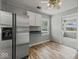 Eat-in kitchen area boasting sleek stainless steel appliances and bright, natural light at 320 Sunset Dr, Shelbyville, IN 46176