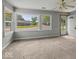 Bright living room featuring large windows and plush carpeting at 320 Sunset Dr, Shelbyville, IN 46176