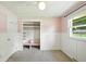 Bedroom featuring closet, carpet, ceiling fan, and window at 3504 White River Ct, Anderson, IN 46012