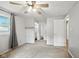 Bright bedroom with ceiling fan, closet, window, and access to full bathroom at 3504 White River Ct, Anderson, IN 46012