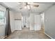 Bedroom with ceiling fan, carpet, window, closet, and access to full bathroom at 3504 White River Ct, Anderson, IN 46012