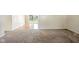 Living room with carpeting, neutral wall colors, and sliding doors to the backyard at 3504 White River Ct, Anderson, IN 46012
