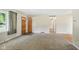 Living room with carpet, hardwood floors, neutral wall colors, and natural light at 3504 White River Ct, Anderson, IN 46012