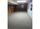 Finished basement offers neutral carpet and drywall block walls at 4032 Roselawn Ave, Columbus, IN 47203