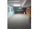 Spacious basement area with bar, drywall and wood paneling at 4032 Roselawn Ave, Columbus, IN 47203