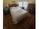 Bedroom with hardwood floors, natural light, and desk area at 4032 Roselawn Ave, Columbus, IN 47203