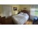 Bedroom includes light yellow walls, a double bed and closet space at 4032 Roselawn Ave, Columbus, IN 47203