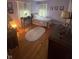 Bedroom with hardwood floors, lilac paint, and natural light from two windows at 4032 Roselawn Ave, Columbus, IN 47203