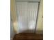 White closet doors with paneling and hardware in a bedroom setting at 4032 Roselawn Ave, Columbus, IN 47203