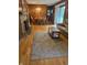Charming dining room with wood flooring, a stone fireplace, and sliding glass doors at 4032 Roselawn Ave, Columbus, IN 47203