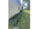 Exterior of the property featuring mature landscaping along the house at 4032 Roselawn Ave, Columbus, IN 47203
