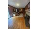 Cozy Gathering room featuring wood paneling, a sliding glass door, and a brick fireplace at 4032 Roselawn Ave, Columbus, IN 47203