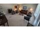 Spacious living room with carpet, neutral walls, and an array of seating options at 4032 Roselawn Ave, Columbus, IN 47203