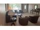 Inviting living room with a large window, lots of seating options, and carpeted floors at 4032 Roselawn Ave, Columbus, IN 47203