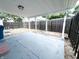 View of covered back patio featuring a concrete floor and fenced in yard at 411 N 18Th St, Noblesville, IN 46060