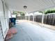 View of covered back patio featuring a concrete floor and fenced in yard at 411 N 18Th St, Noblesville, IN 46060