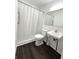 Bathroom features a stall shower, vinyl flooring, and updated fixtures at 411 N 18Th St, Noblesville, IN 46060