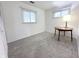 A bright bedroom with carpet, natural light, and a classic table lamp at 411 N 18Th St, Noblesville, IN 46060