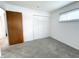 Bright bedroom features neutral carpet, closet, and a large window at 411 N 18Th St, Noblesville, IN 46060