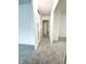 Hallway of home with neutral carpet and white walls at 411 N 18Th St, Noblesville, IN 46060